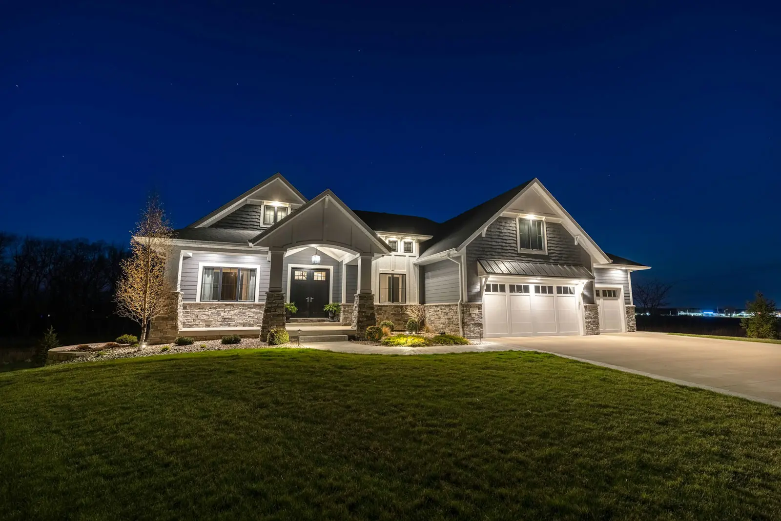 A modern home with outdoor lighting