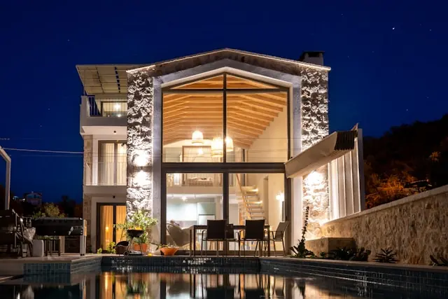 A modern home with outdoor lighting
